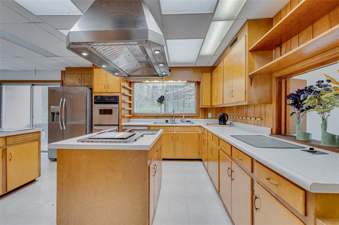 200 Valley View Drive Clemson, SC 29631 - Photo 9 of 31 This kitchen features sleek countertops and ample cabinetry for culinary endeavors.