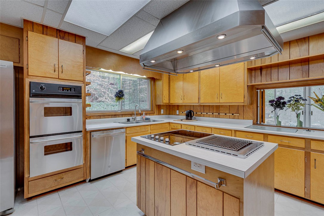 200 Valley View Drive Clemson, SC 29631 - Photo 10 of 31 This spacious kitchen offers a functional layout, abundant cabinetry, and scenic outdoor views.
