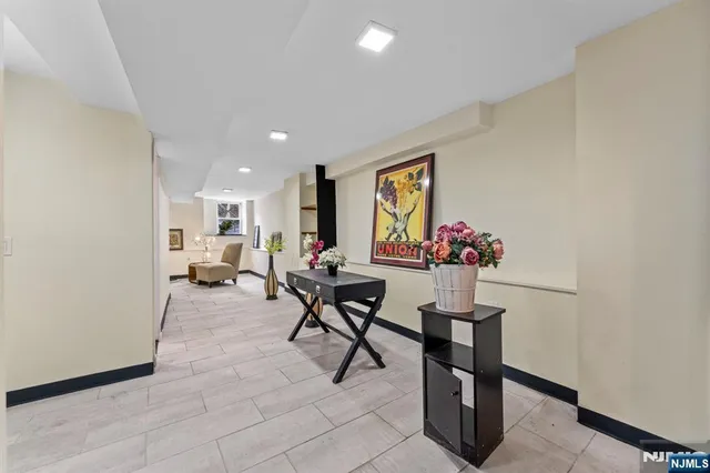 a view of a livingroom with furniture and a window