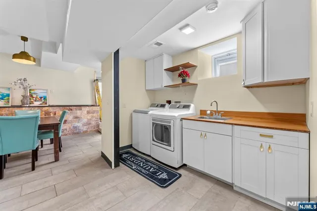 a kitchen with a stove a sink and a refrigerator