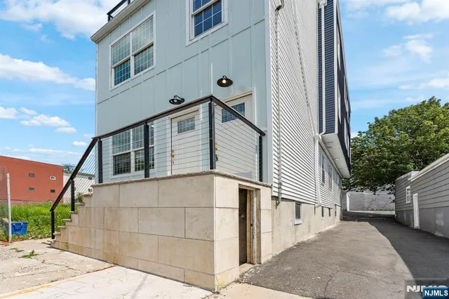 a view of a house with a street
