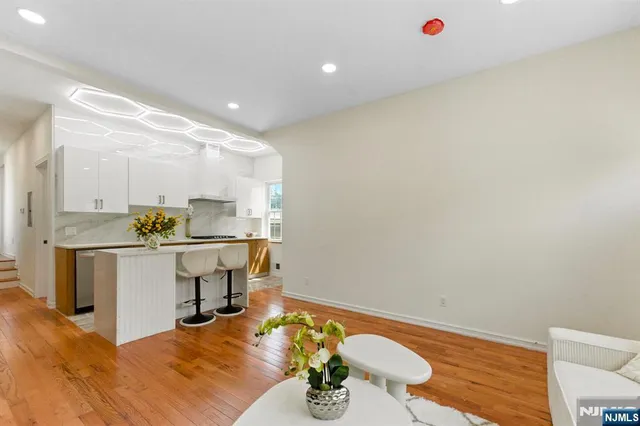 a kitchen with stainless steel appliances granite countertop a sink and cabinets