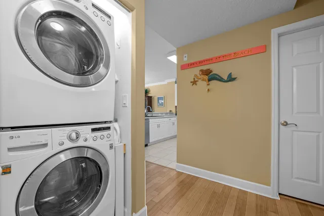 a view of a hallway with washer and dryer