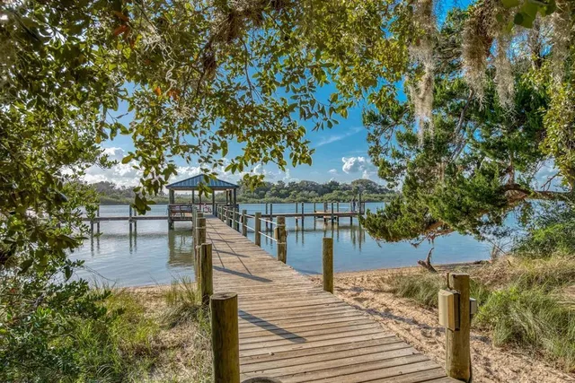 a view of a swimming pool with a yard
