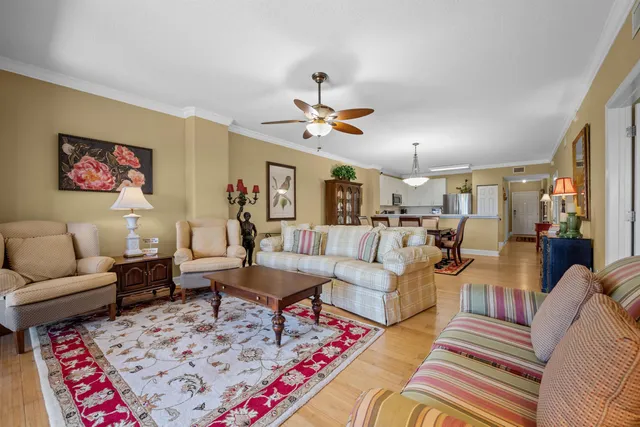 a living room with furniture and a rug