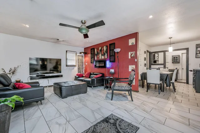 a living room with furniture and a flat screen tv