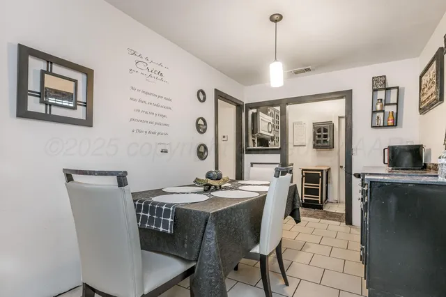 a dining room with furniture and window