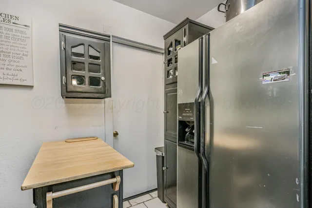 a bathroom with a shower and a sink