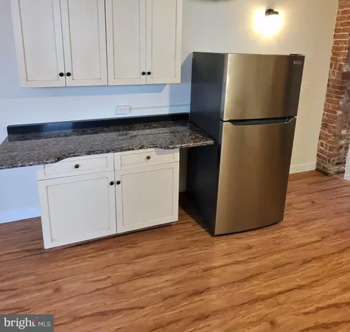 a kitchen with stainless steel appliances a stove and a refrigerator