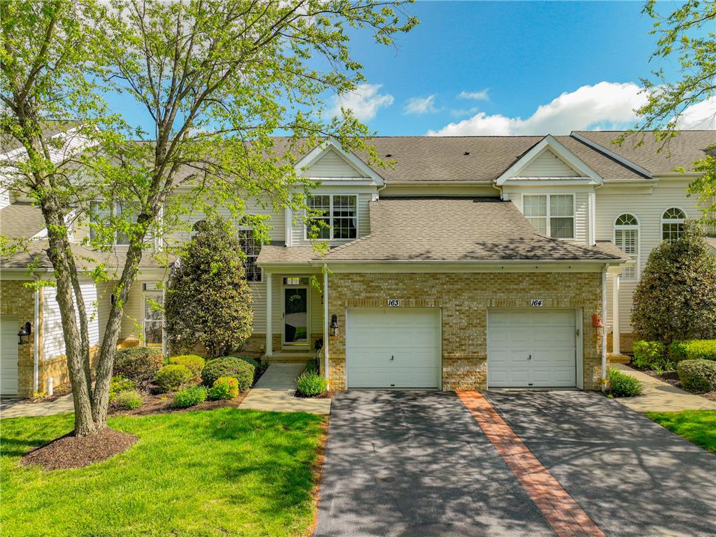 163 Muirfield Way Easton, PA 18042 - Photo 1 of 48 a view of a white house with a yard and large tree