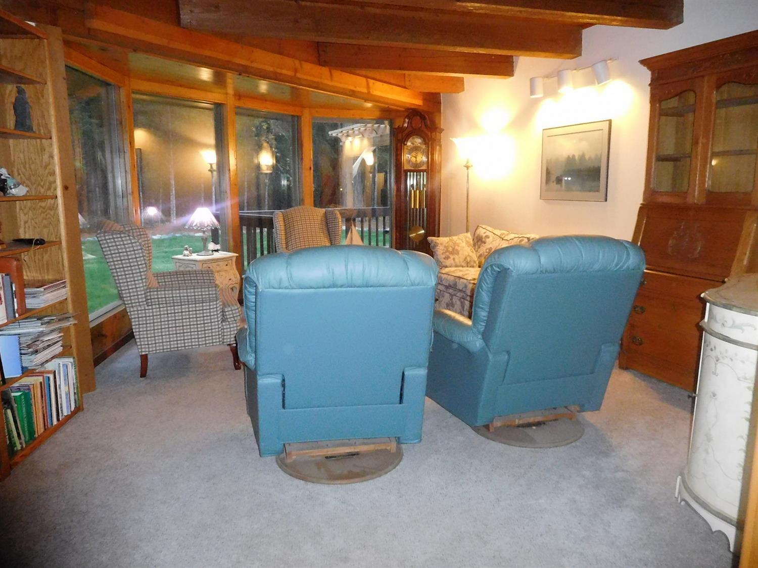 7133 Rockydale Road Cave Junction, OR 97523 - Photo 9 of 23 Living room has floor to ceiling windows