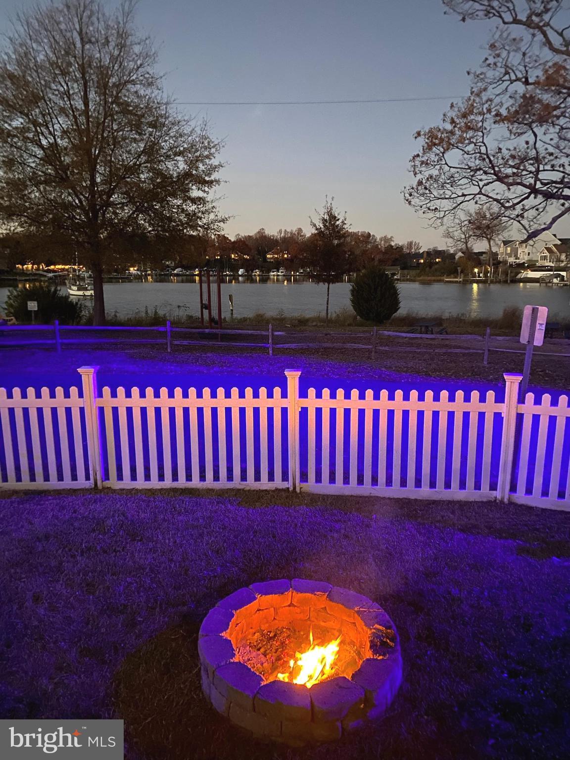 431 Shore Drive Edgewater, MD 21037 - Photo 50 of 53 evening view from side yard and fire pit