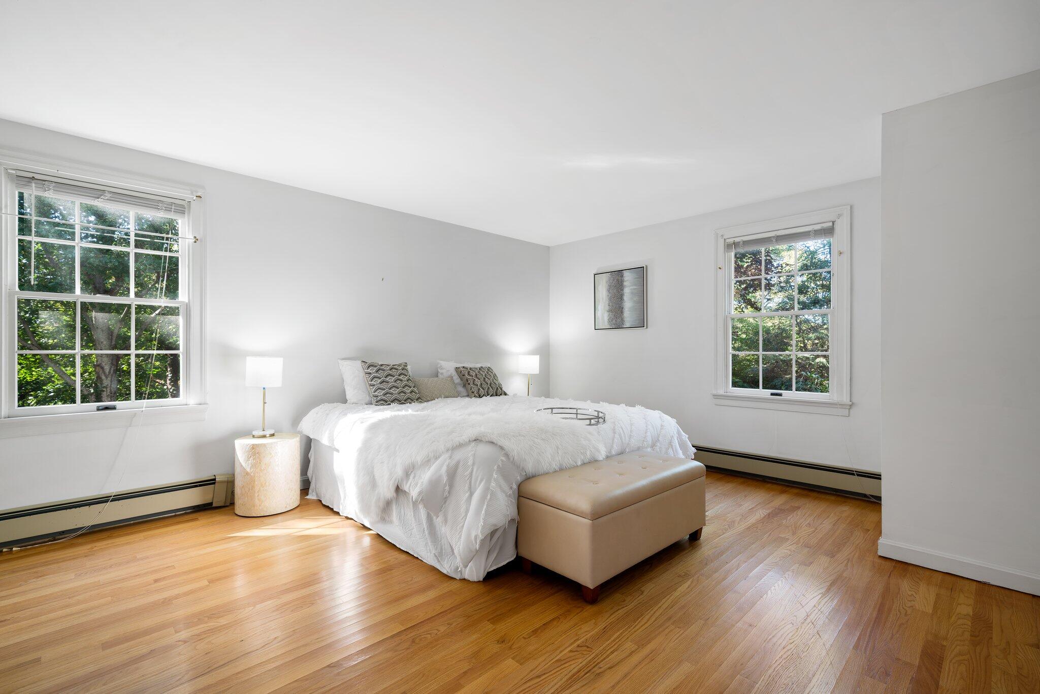 7 Abbey Gate Road Cotuit, MA 02635 - Photo 16 of 41 a bedroom with a bed and a large window