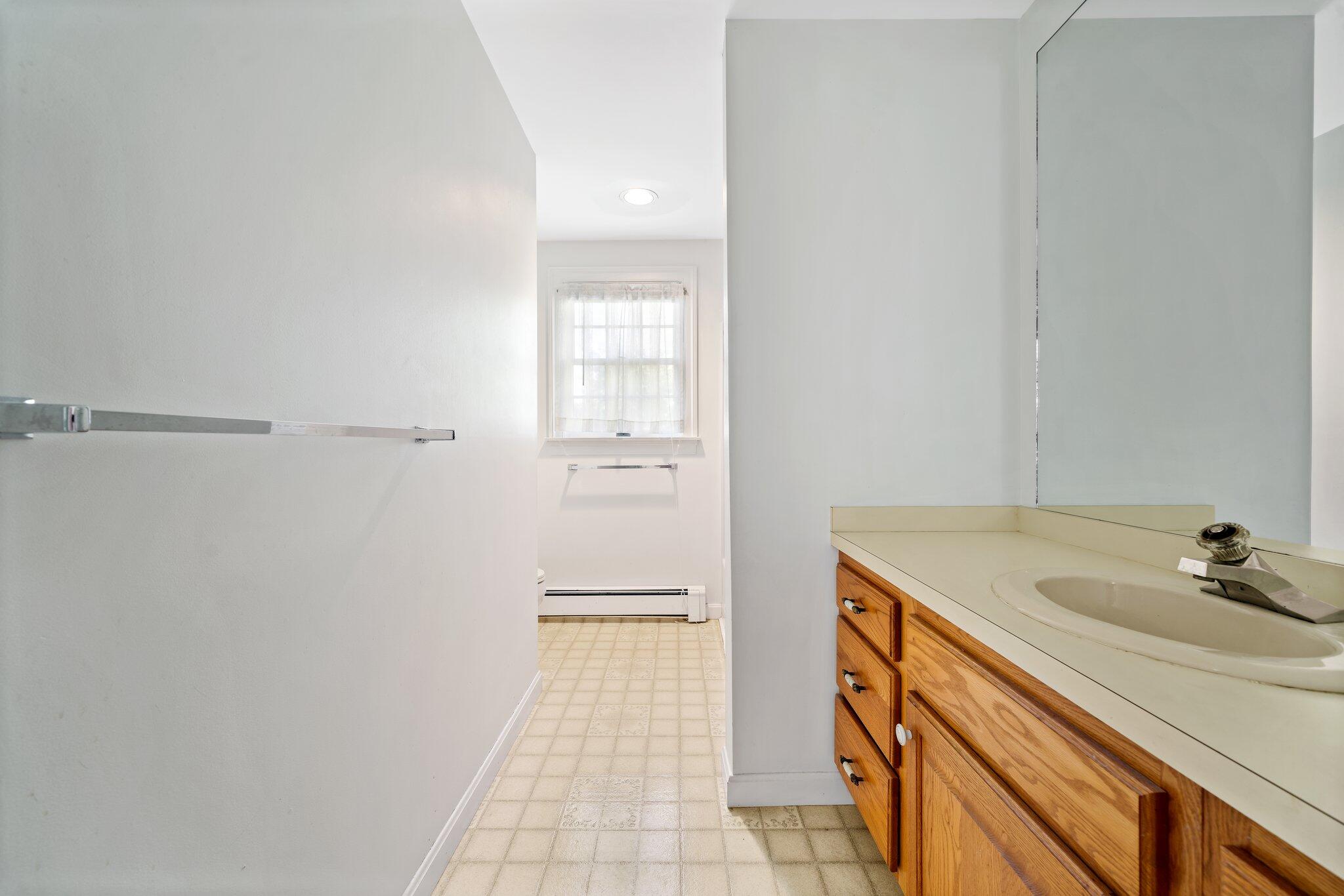 7 Abbey Gate Road Cotuit, MA 02635 - Photo 17 of 41 a bathroom with a sink and vanity