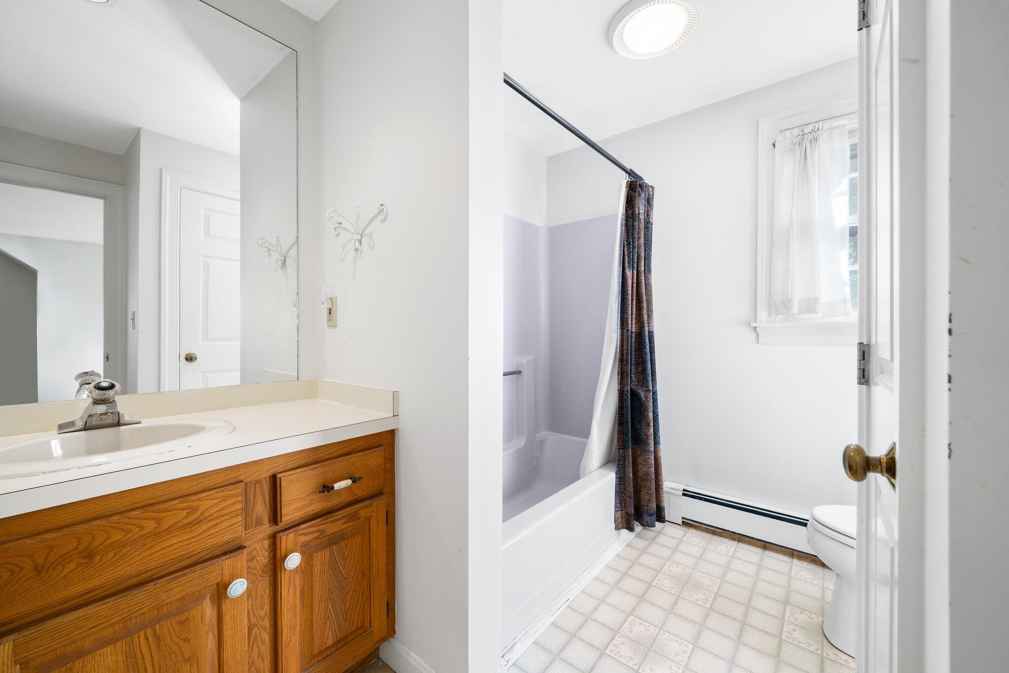 7 Abbey Gate Road Cotuit, MA 02635 - Photo 22 of 41 a bathroom with a sink and a mirror