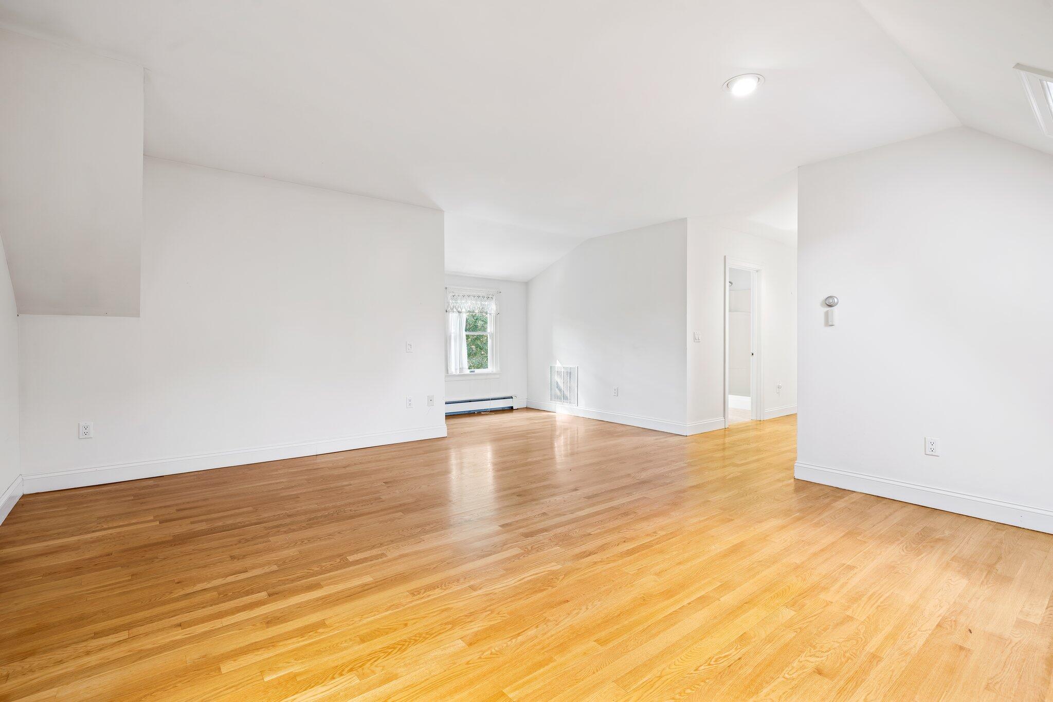 7 Abbey Gate Road Cotuit, MA 02635 - Photo 24 of 41 a view of empty room with wooden floor and fan