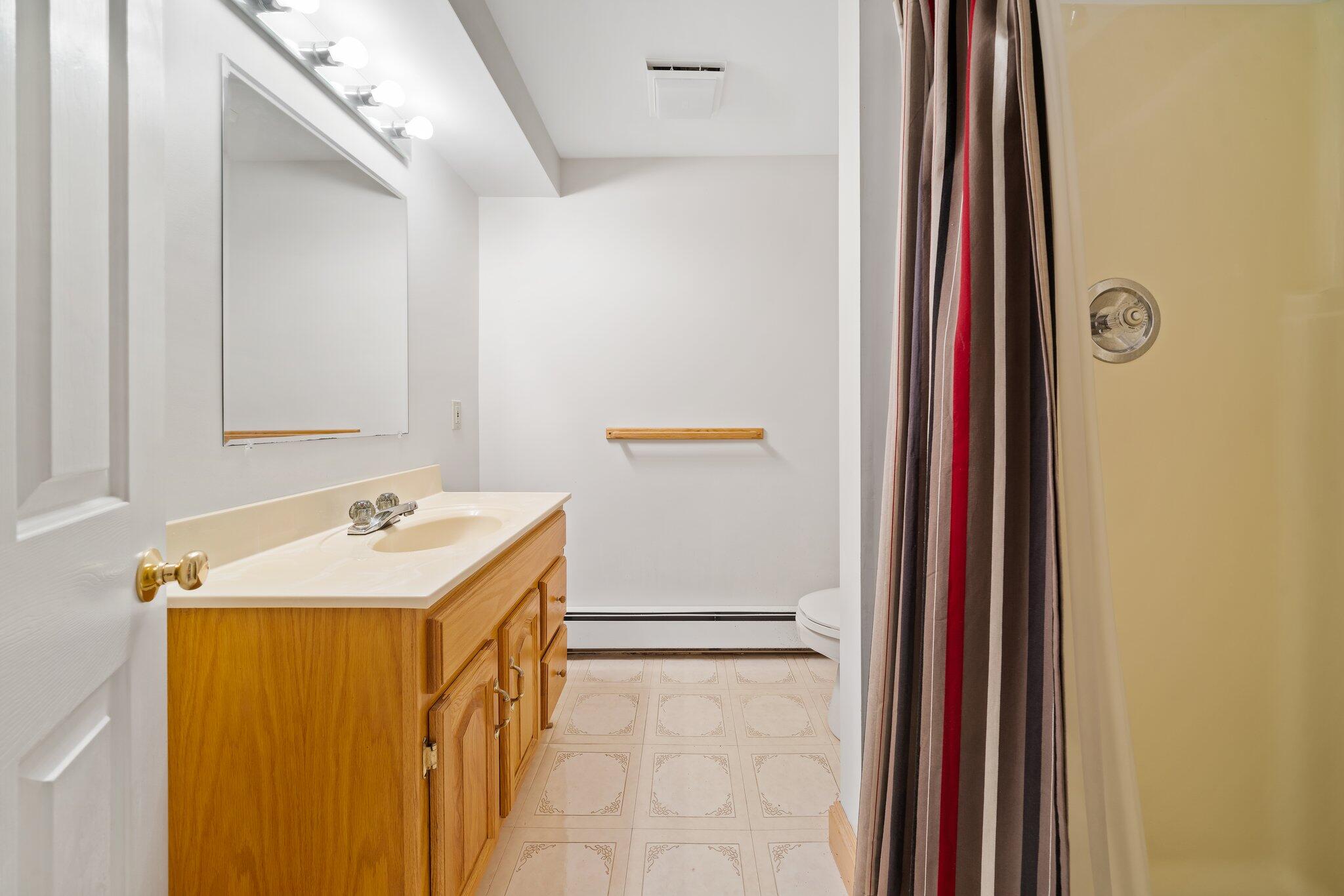7 Abbey Gate Road Cotuit, MA 02635 - Photo 29 of 41 a bathroom with a sink and a mirror