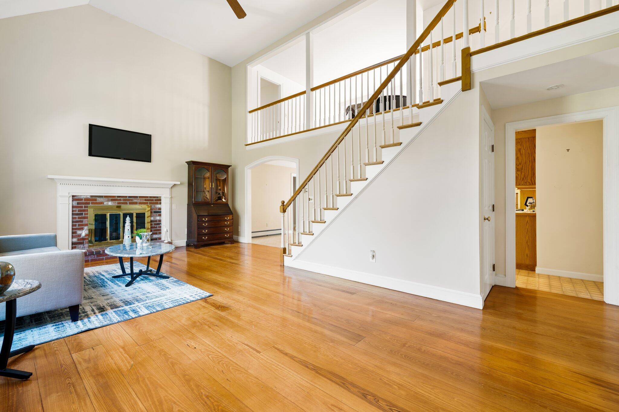 7 Abbey Gate Road Cotuit, MA 02635 - Photo 3 of 41 a view of a livingroom with furniture fire place and an entryway