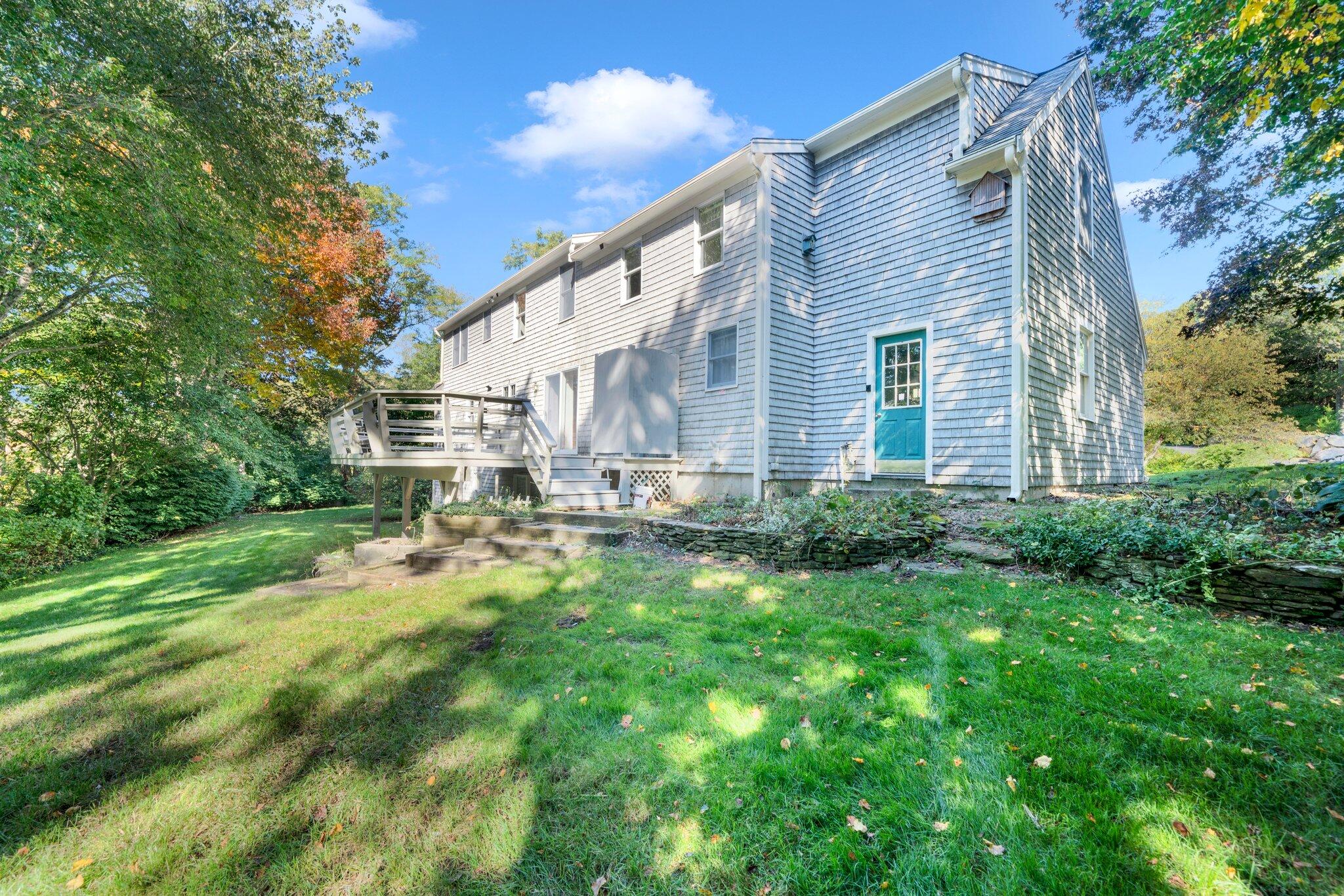 7 Abbey Gate Road Cotuit, MA 02635 - Photo 38 of 41 a house view with a garden space