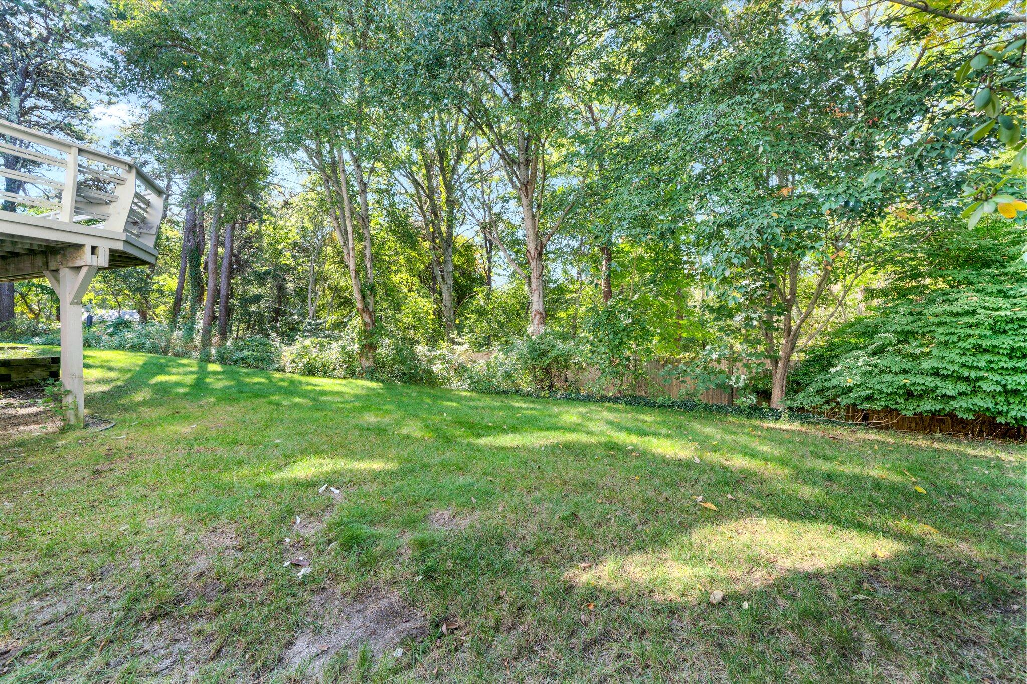 7 Abbey Gate Road Cotuit, MA 02635 - Photo 39 of 41 a view of a yard with a tree