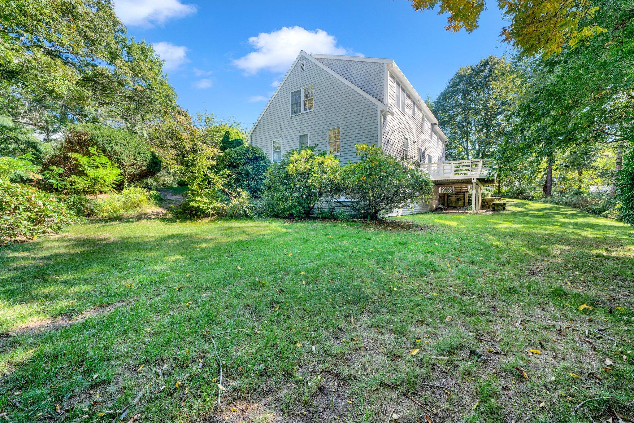 7 Abbey Gate Road Cotuit, MA 02635 - Photo 40 of 41 a view of a house with a yard and sitting area
