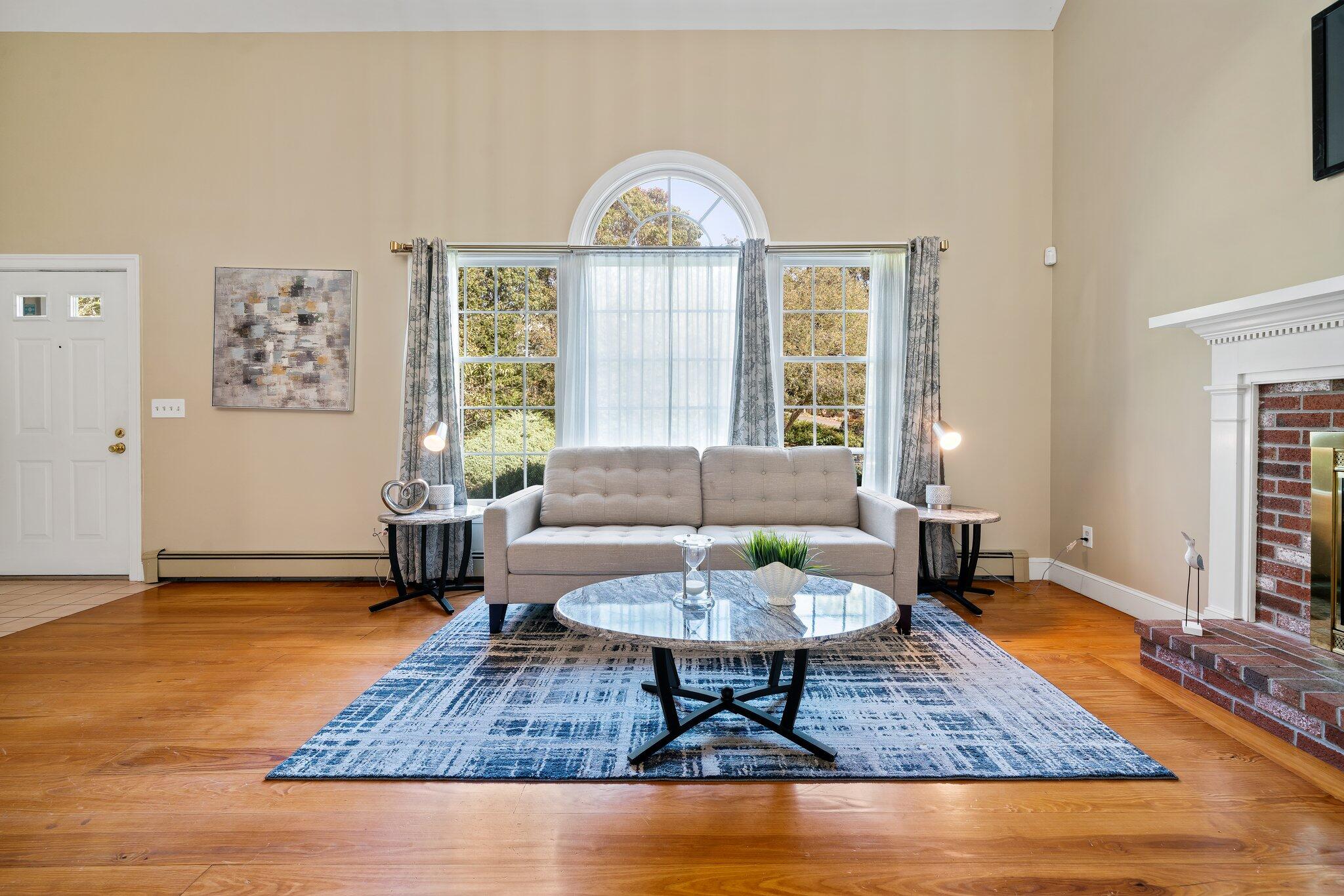 7 Abbey Gate Road Cotuit, MA 02635 - Photo 4 of 41 a living room with furniture and a table