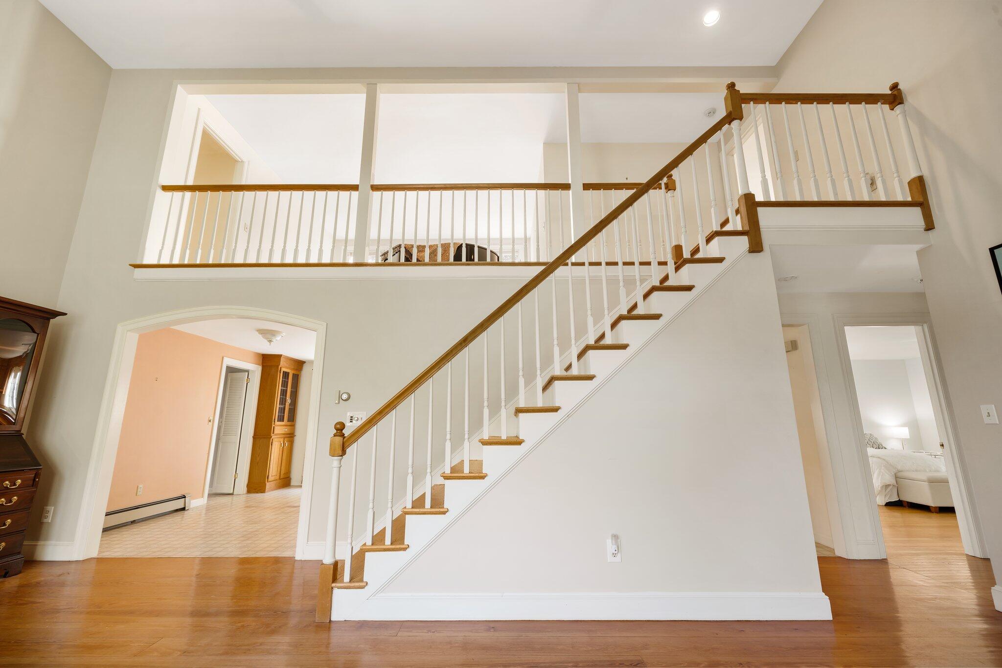 7 Abbey Gate Road Cotuit, MA 02635 - Photo 6 of 41 a view of staircase with white walls and a window
