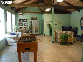 39 Easy Street Florence, OR 97439 - Photo 11 of 24 a living room with furniture and a fireplace