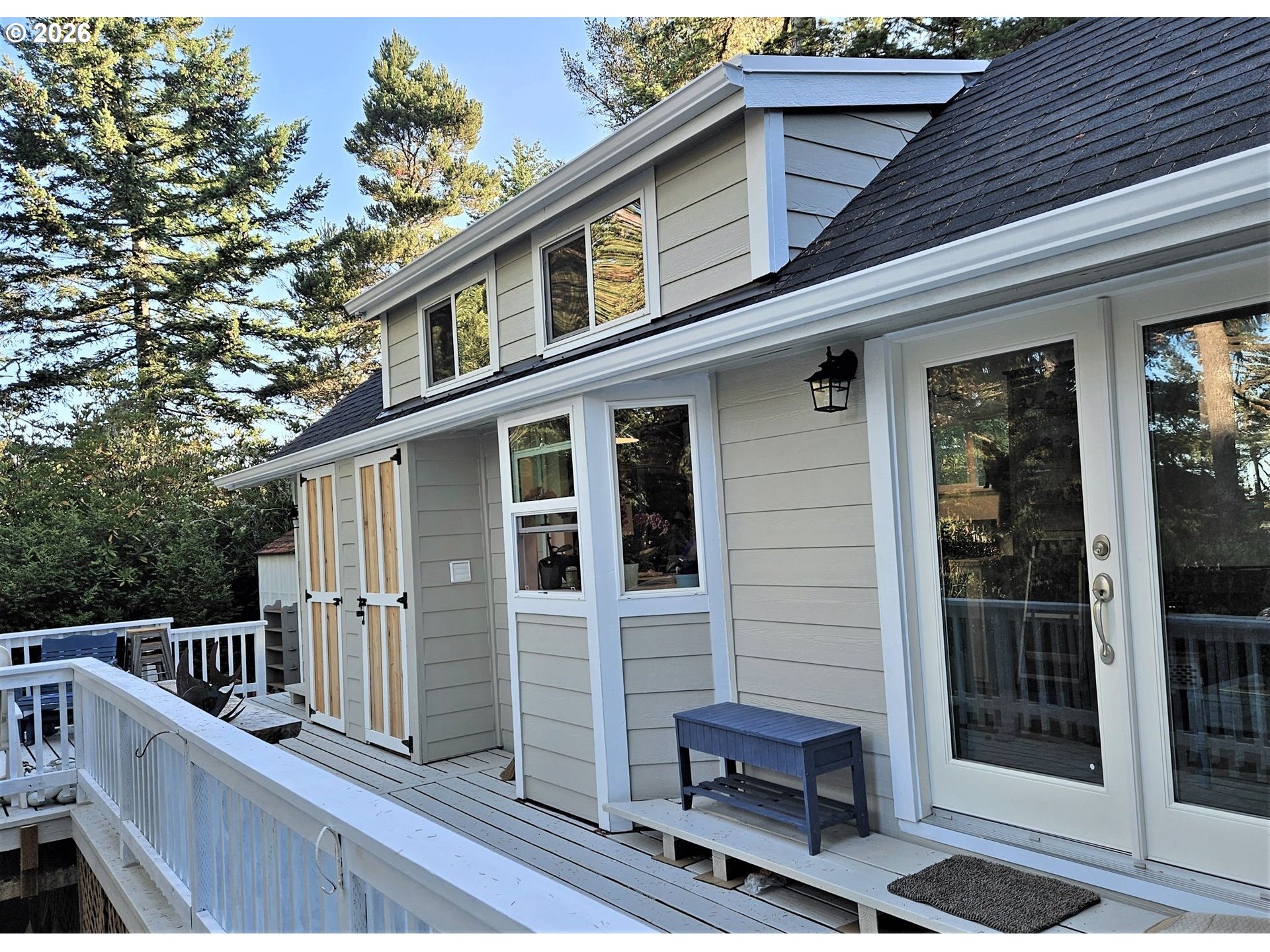39 Easy Street Florence, OR 97439 - Photo 15 of 24 a view of a house with a deck and furniture