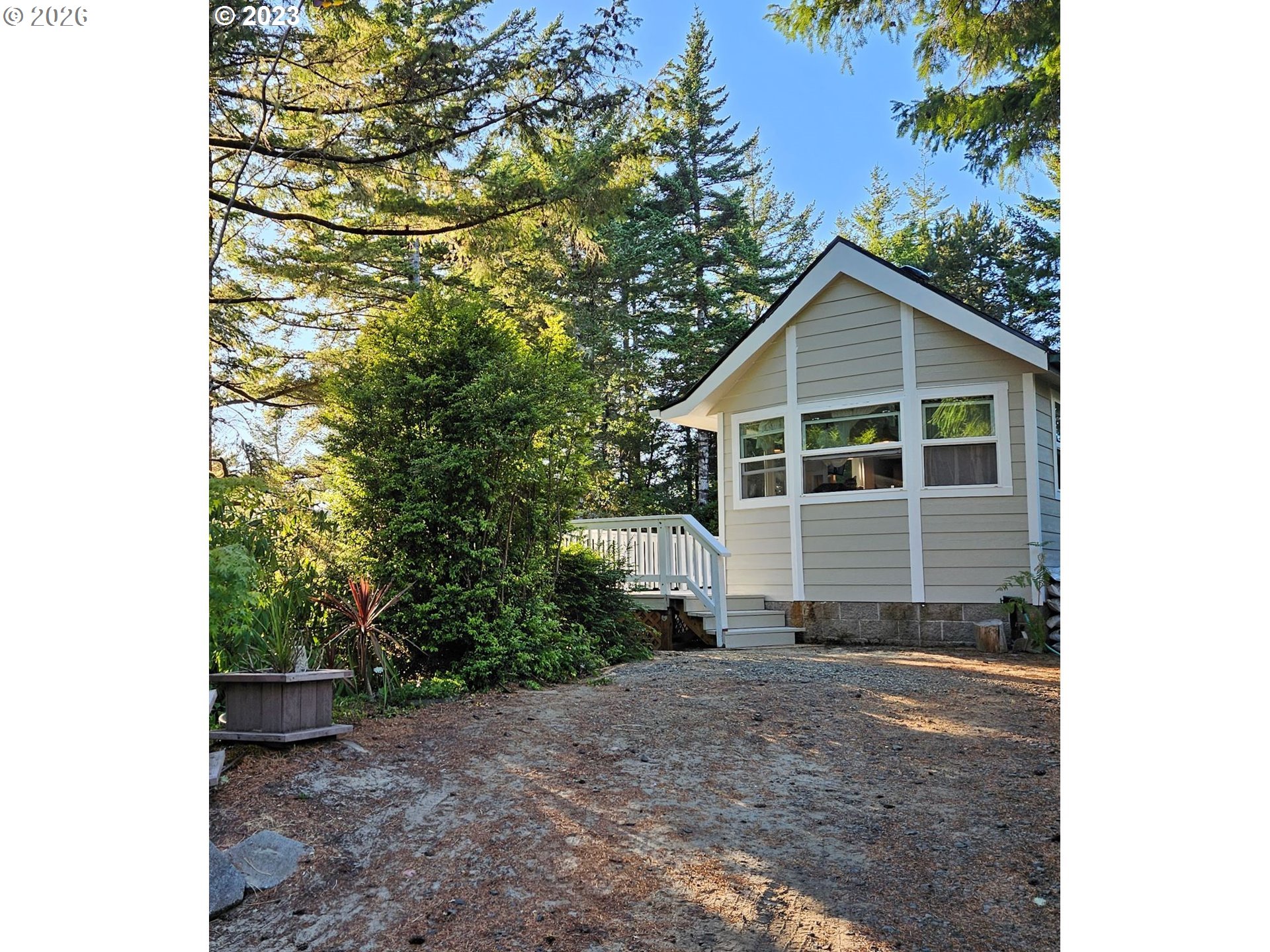 39 Easy Street Florence, OR 97439 - Photo 22 of 24 a view of a house with a yard and garage