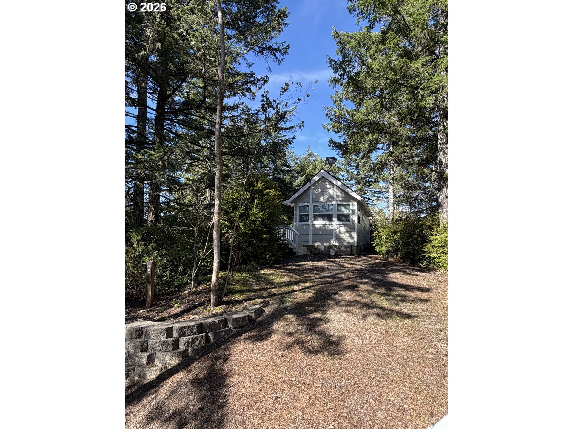 39 Easy Street Florence, OR 97439 - Photo 23 of 24 a view of a house with a tree