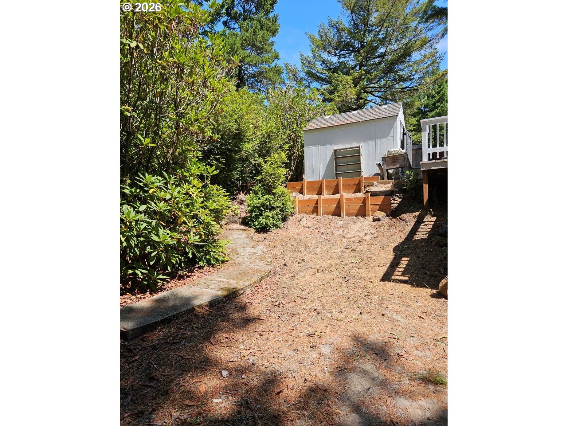 39 Easy Street Florence, OR 97439 - Photo 4 of 24 a view of a backyard with a sitting area