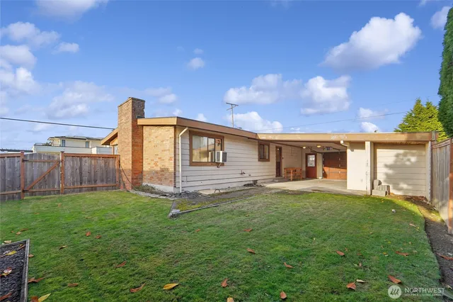 a view of a house with a yard and deck
