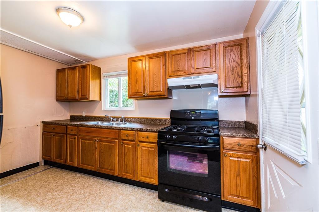 409 Grove Street McKees Rocks, PA 15136 - Photo 9 of 23 Kitchen with door to rear yard.