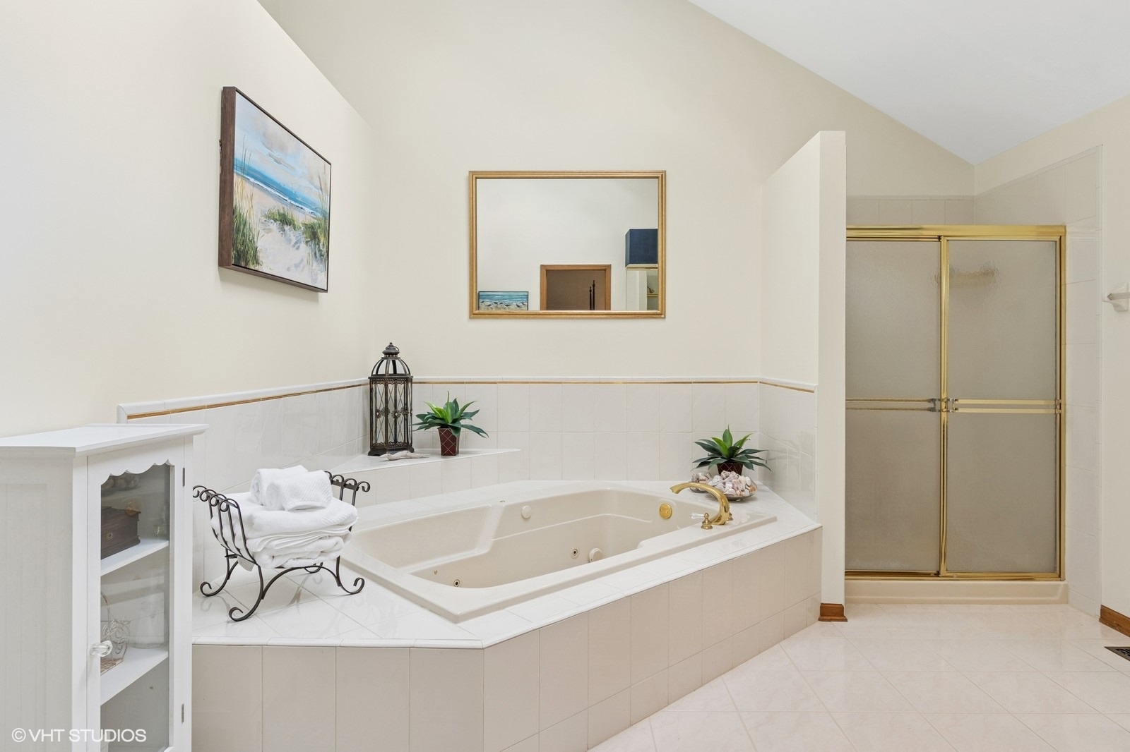 727 Mesa Drive Naperville, IL 60565 - Photo 16 of 31 a white bath tub sitting next to a bathroom sink