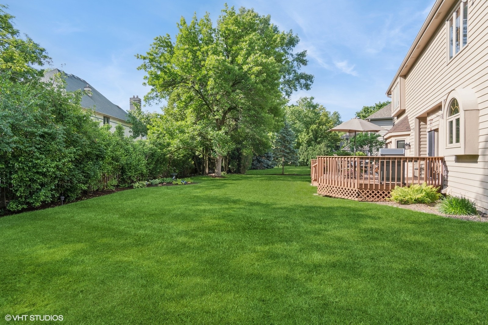 727 Mesa Drive Naperville, IL 60565 - Photo 26 of 31 a view of a house with a yard and a large tree