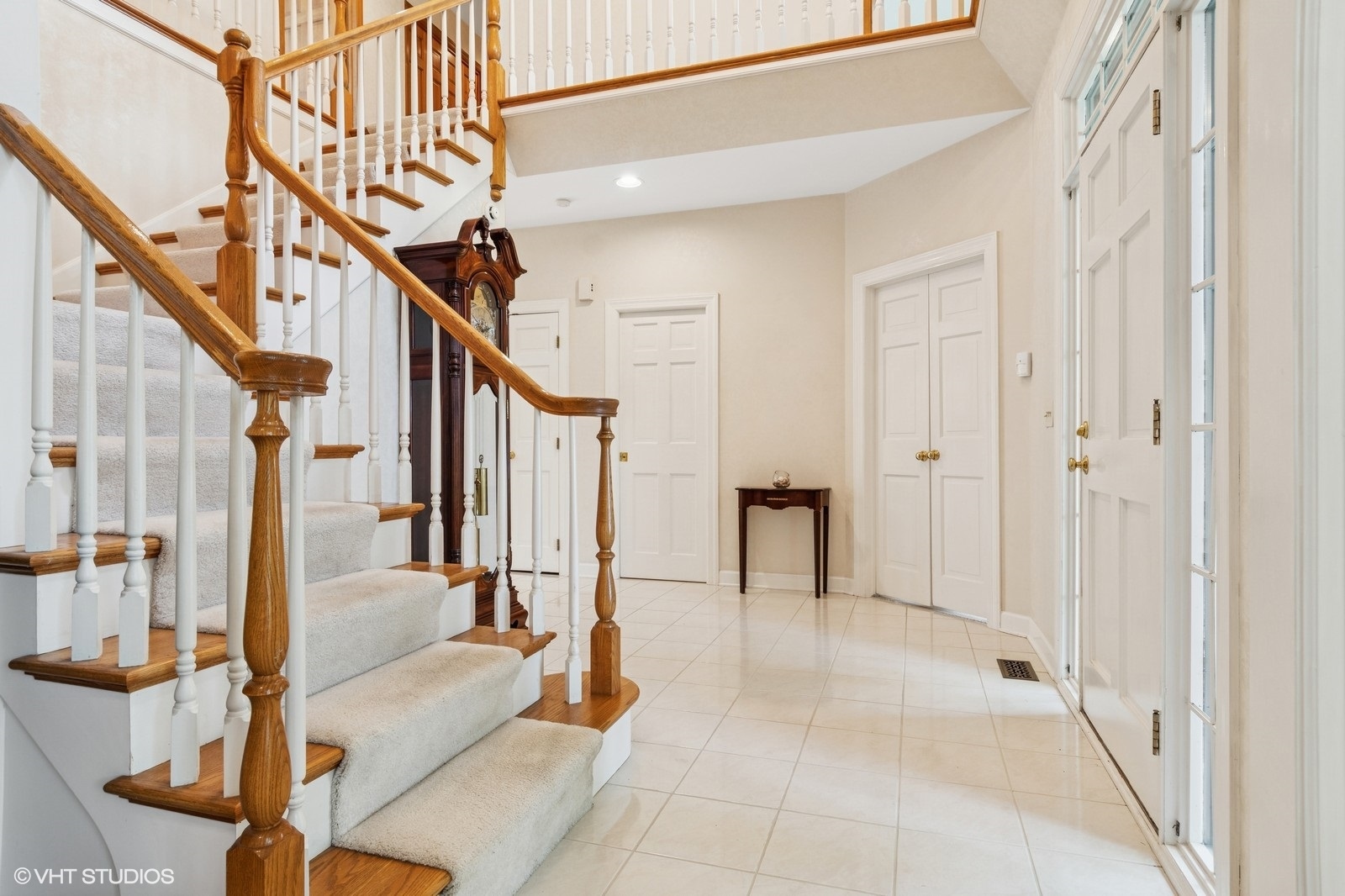 727 Mesa Drive Naperville, IL 60565 - Photo 3 of 31 a view of staircase with white walls and railing