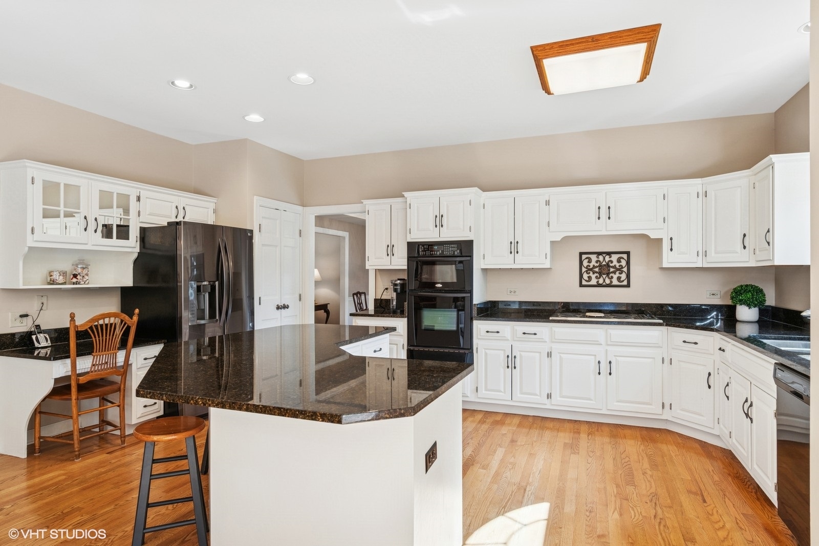 727 Mesa Drive Naperville, IL 60565 - Photo 5 of 31 a kitchen with stainless steel appliances granite countertop a sink refrigerator and cabinets
