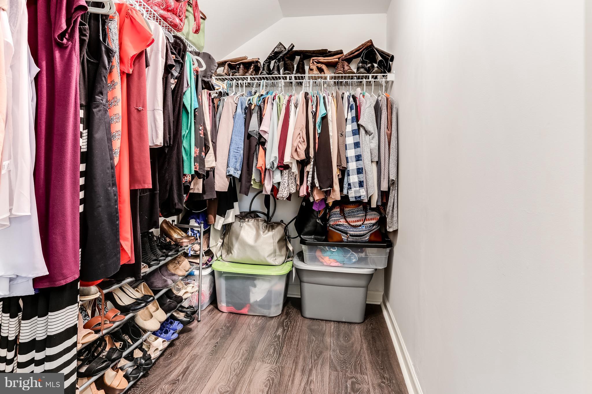 6912 Red Clay Forge, Unit 2 Elkridge, MD 21075 - Photo 14 of 30 a view of walk in closet with clothes and shoes