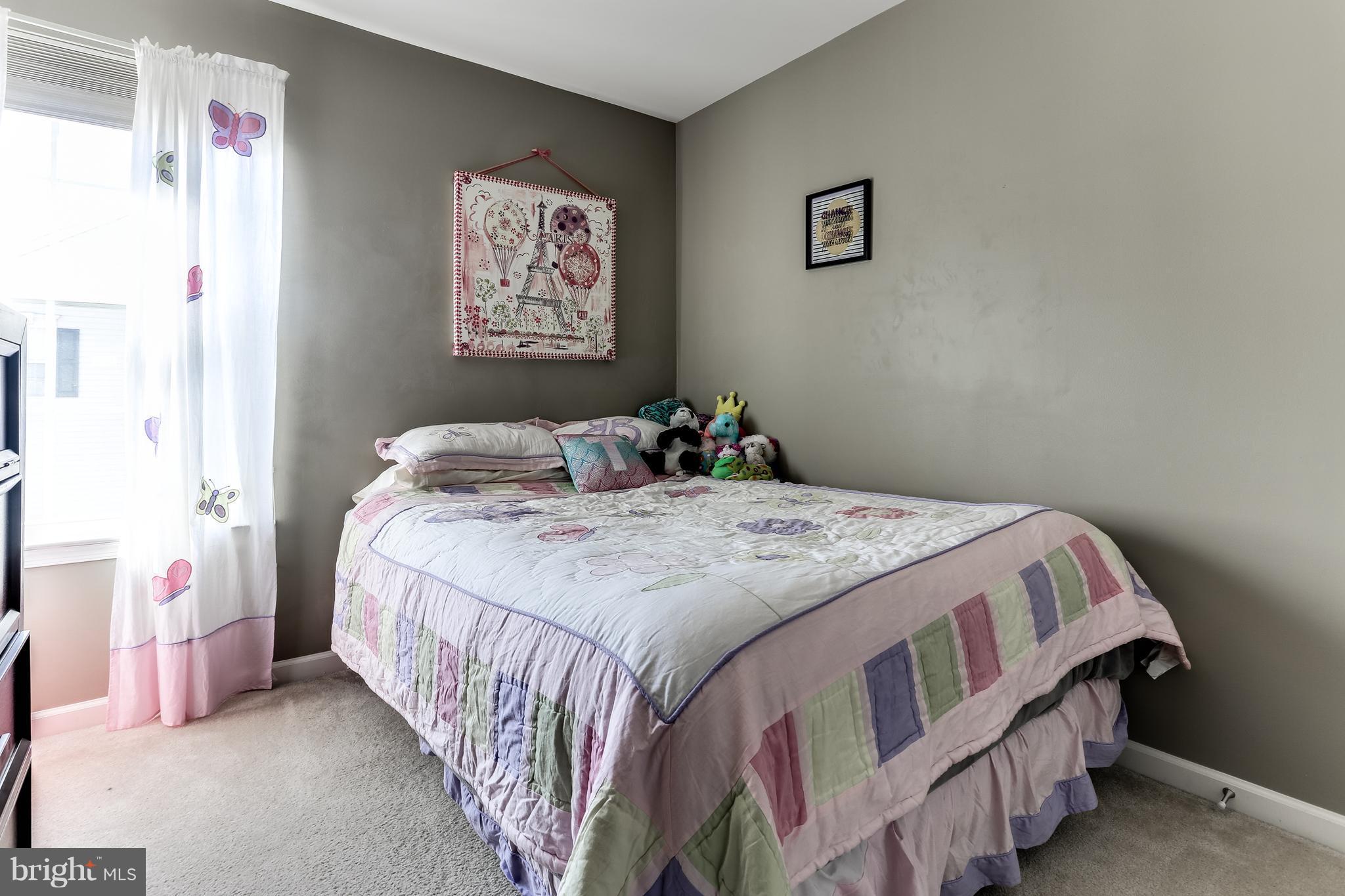 6912 Red Clay Forge, Unit 2 Elkridge, MD 21075 - Photo 16 of 30 a bedroom with a bed and a painting on the wall