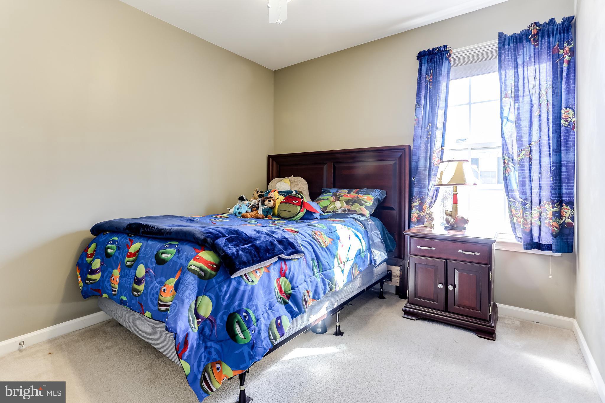 6912 Red Clay Forge, Unit 2 Elkridge, MD 21075 - Photo 17 of 30 a bedroom with a bed and window