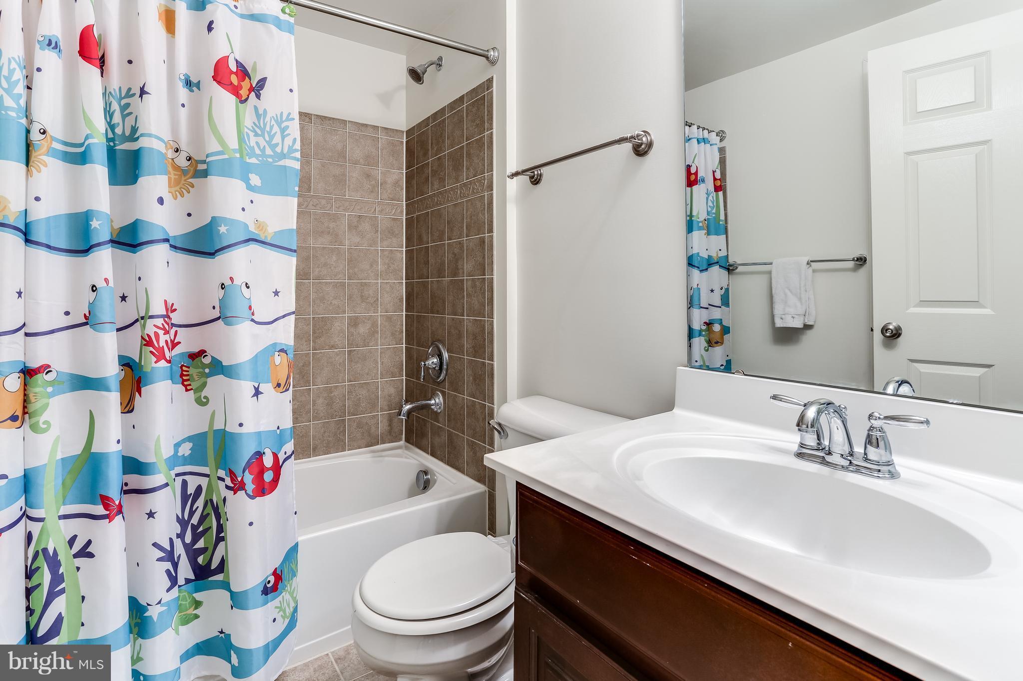 6912 Red Clay Forge, Unit 2 Elkridge, MD 21075 - Photo 18 of 30 a bathroom with a sink toilet vanity and bathtub