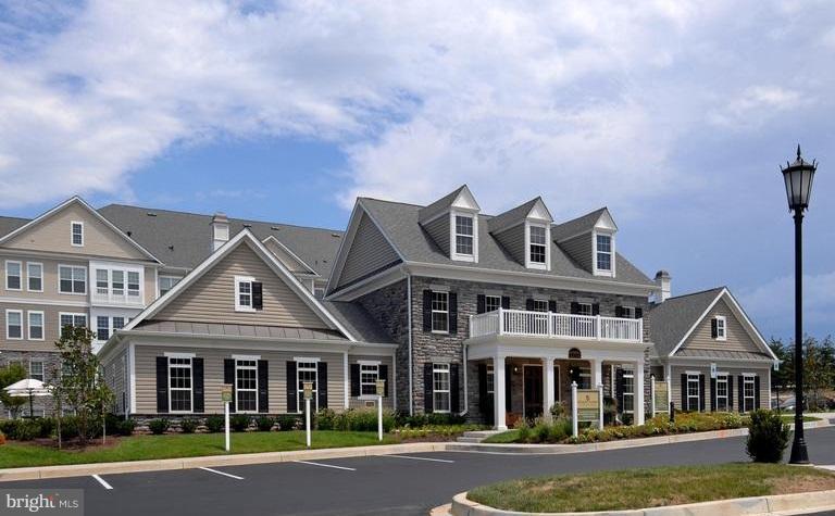 6912 Red Clay Forge, Unit 2 Elkridge, MD 21075 - Photo 25 of 30 front view of multiple houses with a yard