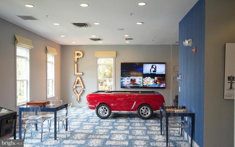 6912 Red Clay Forge, Unit 2 Elkridge, MD 21075 - Photo 28 of 30 a car parked in a room next to a window