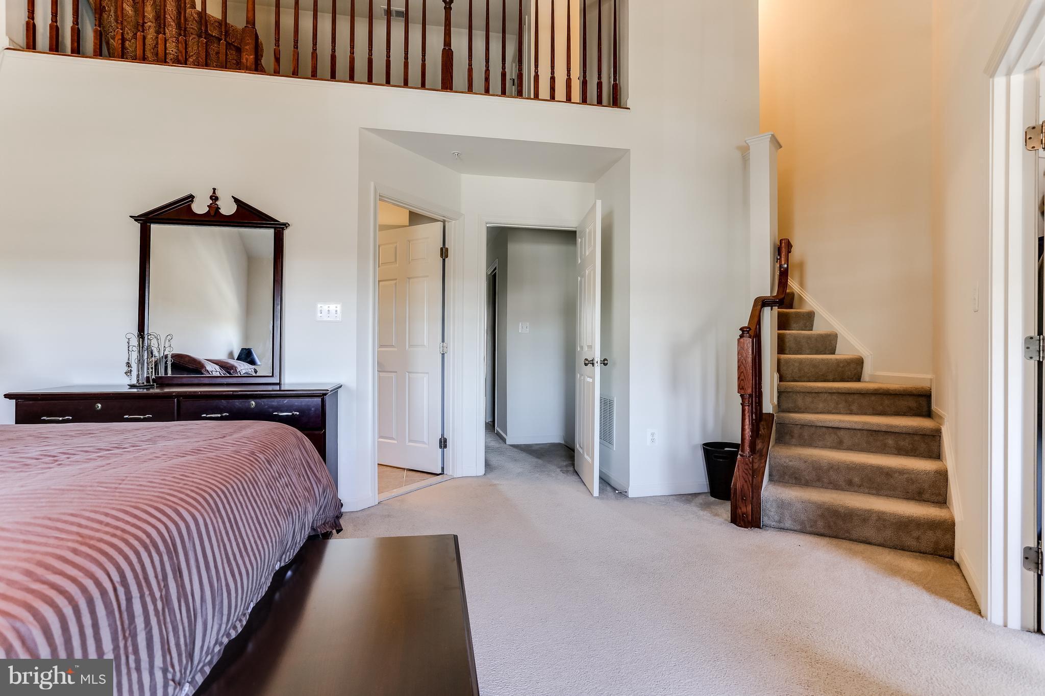 6912 Red Clay Forge, Unit 2 Elkridge, MD 21075 - Photo 10 of 30 a bedroom with bed and a night stand