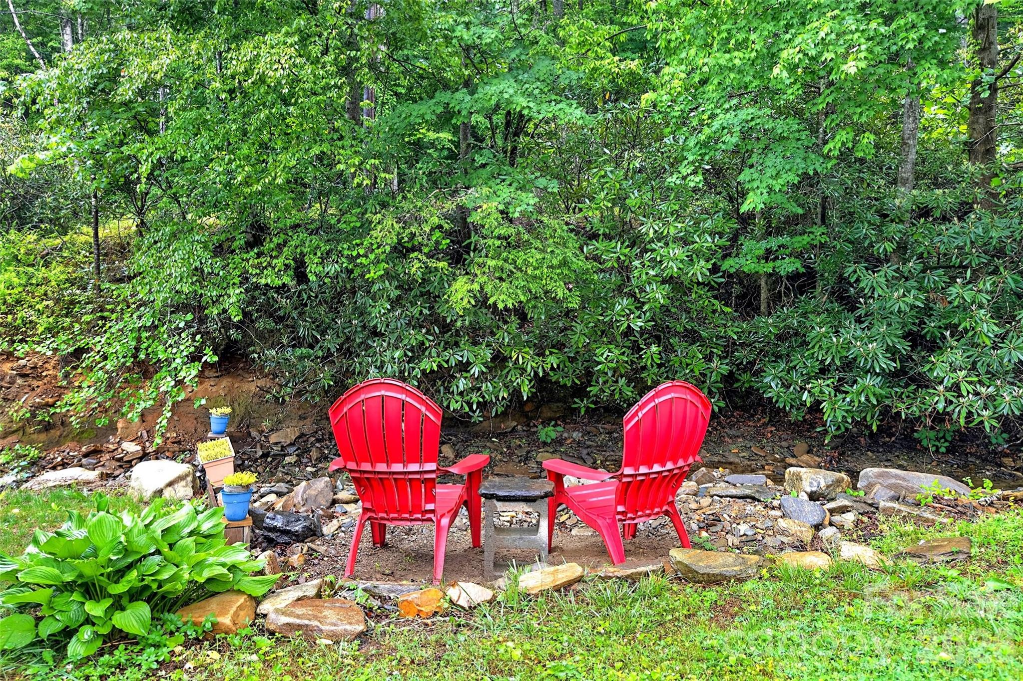 227 Locust Cove Road Marion, NC 28752 - Photo 19 of 34 a aerial view of a dinning table and chairs in the patio