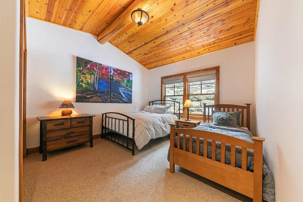 a bedroom with furniture and a window