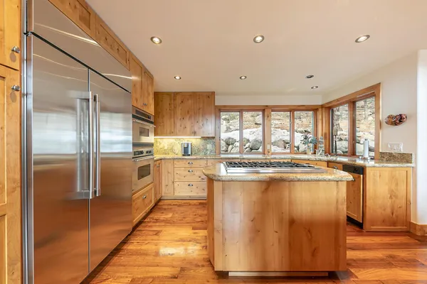 a kitchen with counter top space and appliances