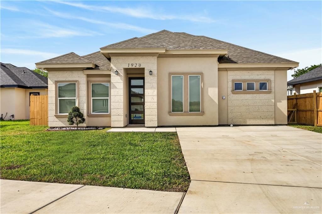 1920 Trinity Street Donna, TX 78537 - Photo 2 of 23 Contemporary single-story residence featuring a stucco and stone-look facade