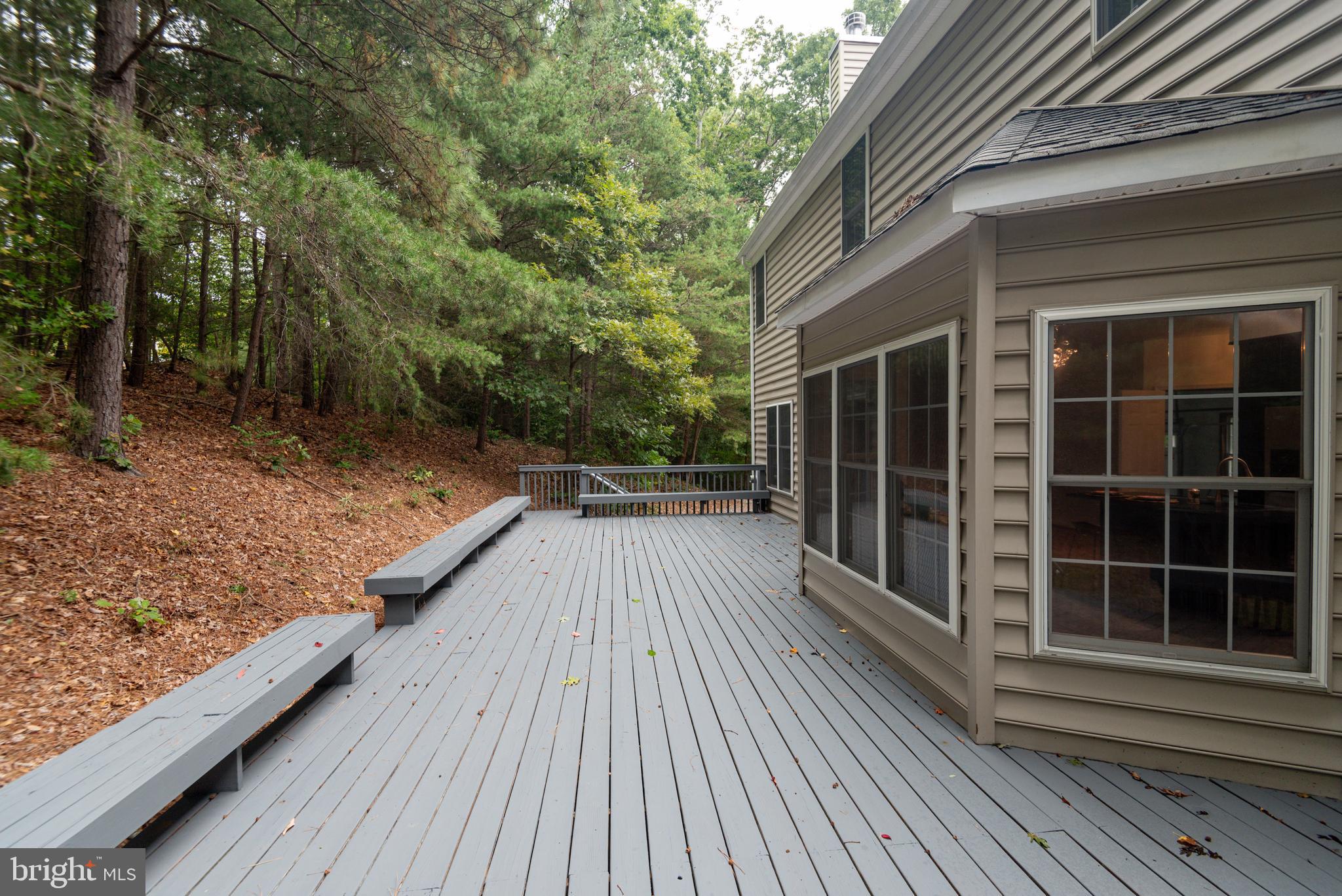 1780 Rudolph Lane Lusby, MD 20657 - Photo 8 of 40 a view of balcony with wooden floor and fence and floor to ceiling window